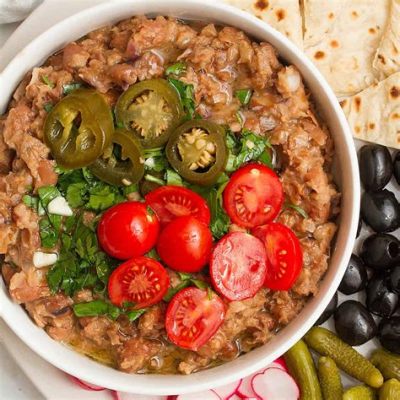  Ful Medames:  Bountiful Beans Cooked in Garlic Embrace and Spiced with Aromatic Cumin!